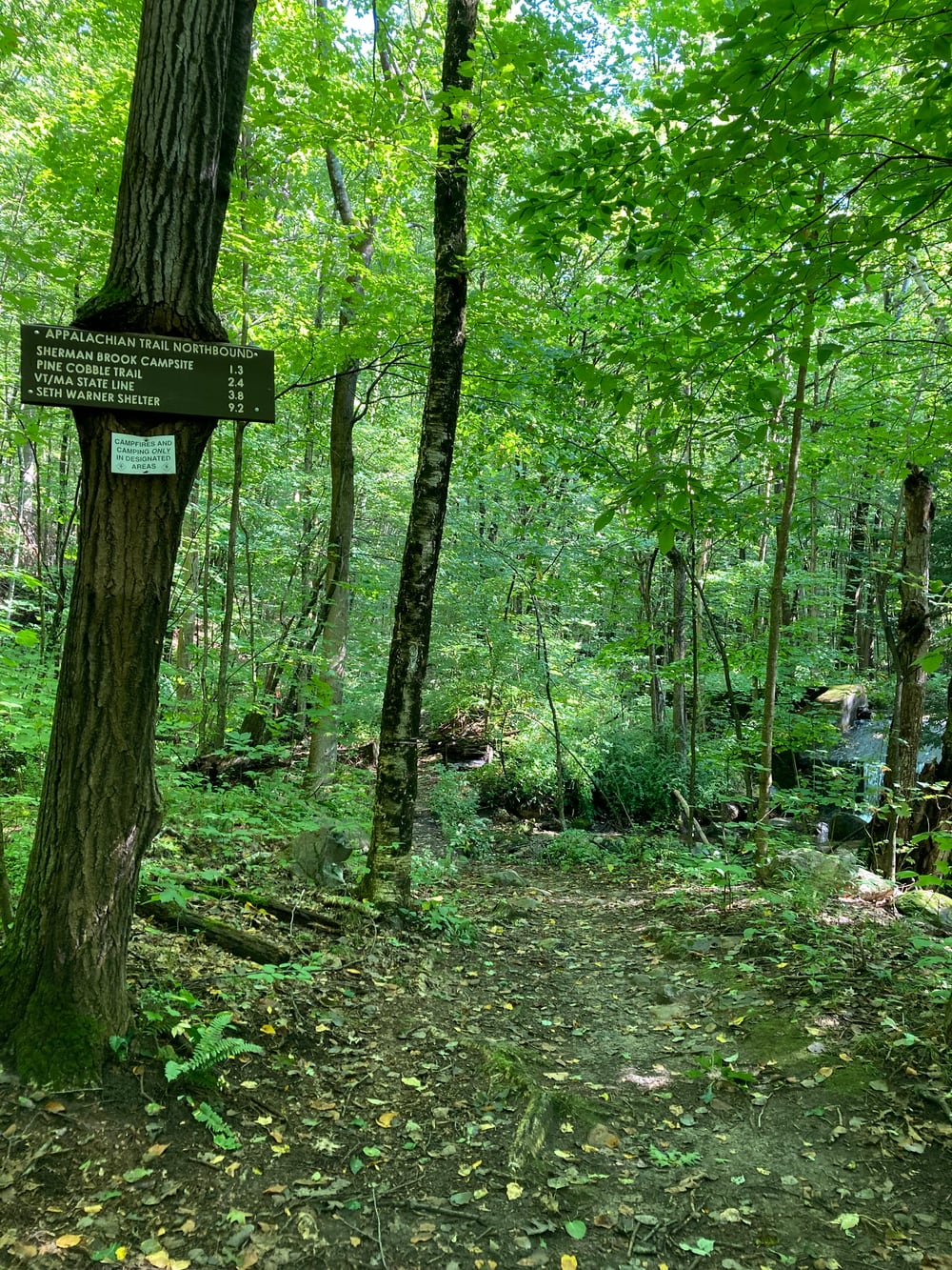 Sign showing distances on the trail